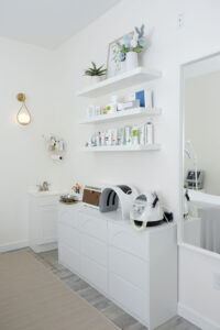 Calm beauty salon treatment room interior design with soft neutral colours