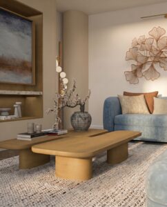 Soft neutral living room design with a blue corner sofa, curved wood coffee tables, textured rug and sculptural wall art.